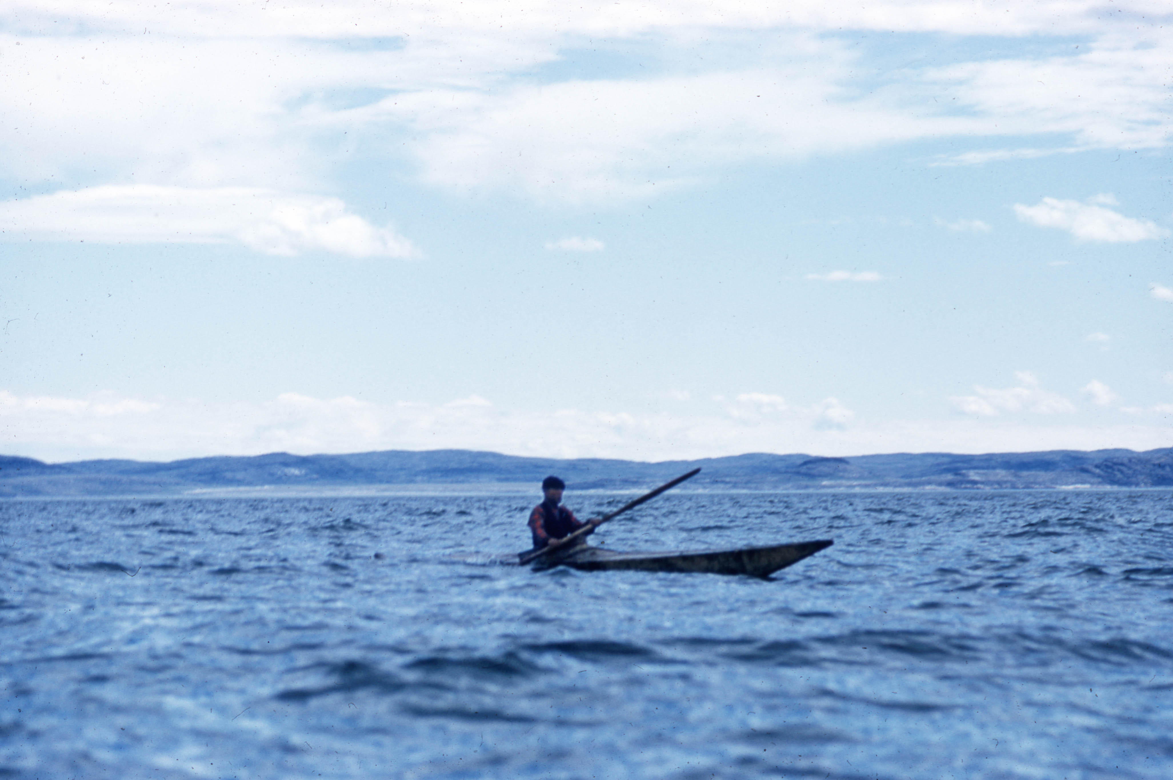 Young man in a sealskin kayak near George River, Quebec, 1960