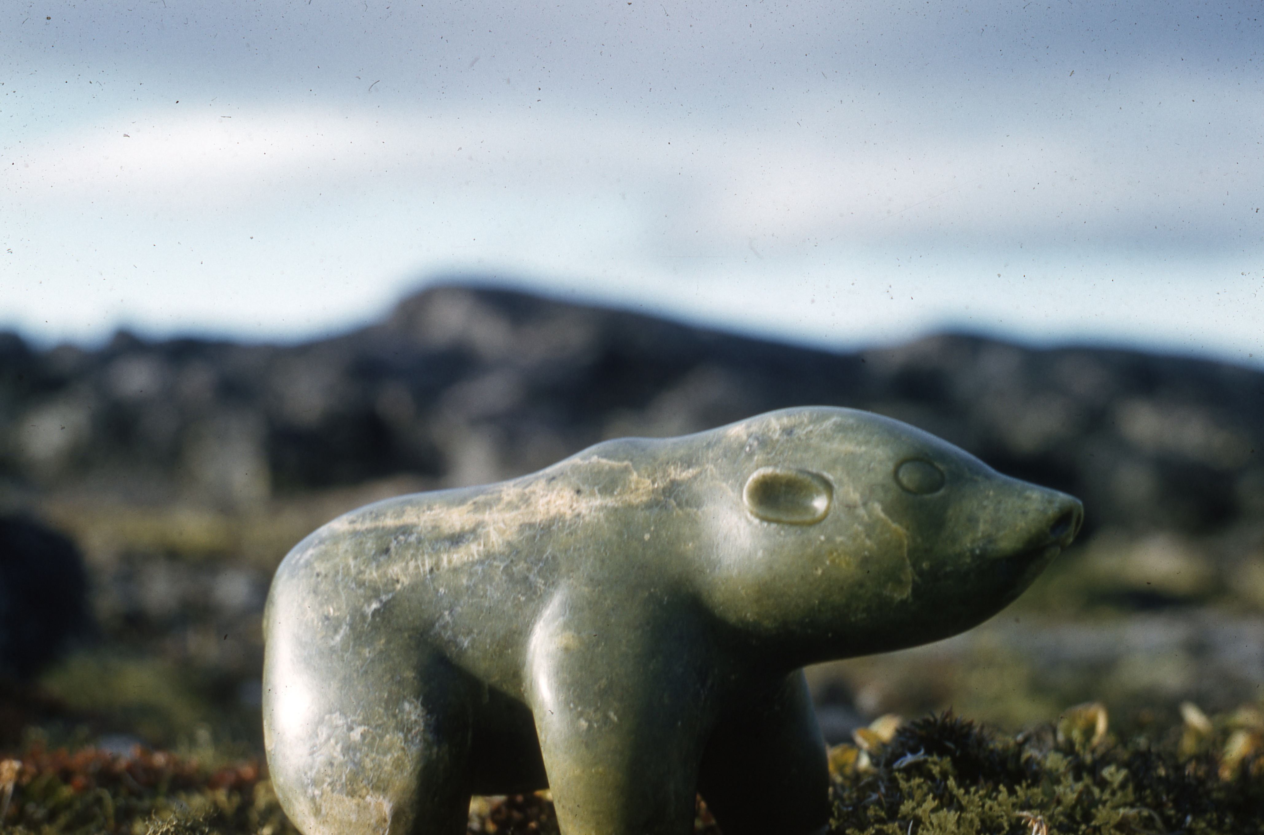 A stone carving of a polar bear by Niviaksiak