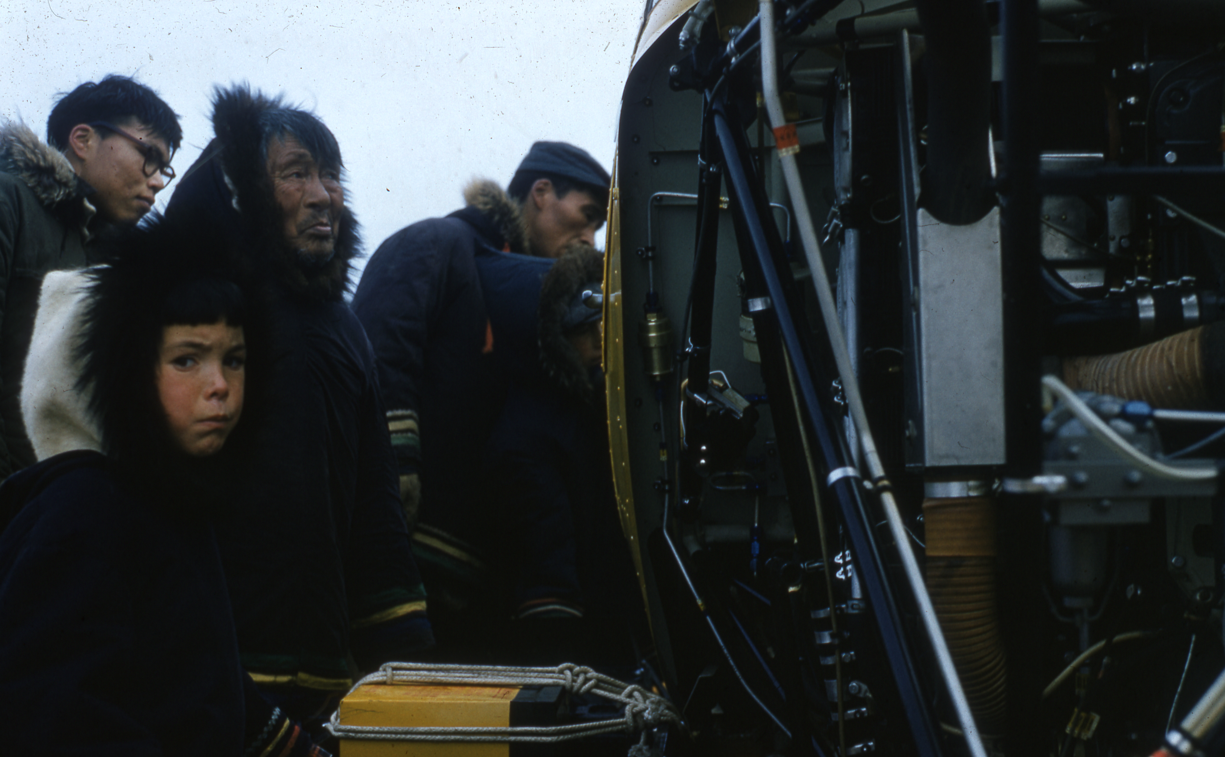 Several people standing by a helicopter in Cape DorsetCape Dorset, 1960