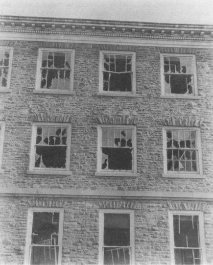 Photograph showing damage to windows on the east end of the Science Building by the 1917 explosion.