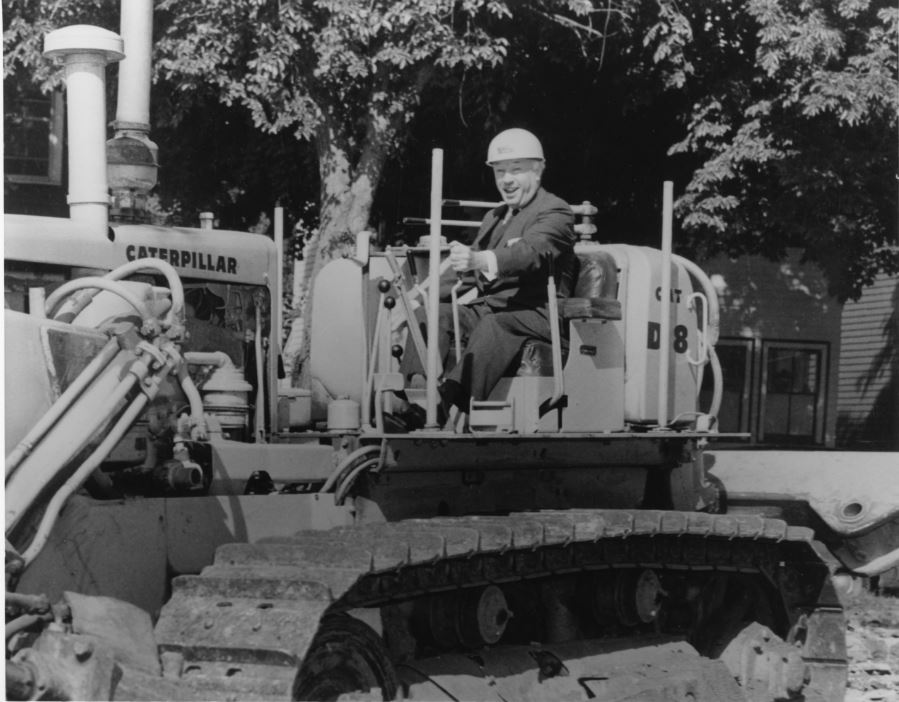 Photograph of Henry Hick sitting in a bulldozer